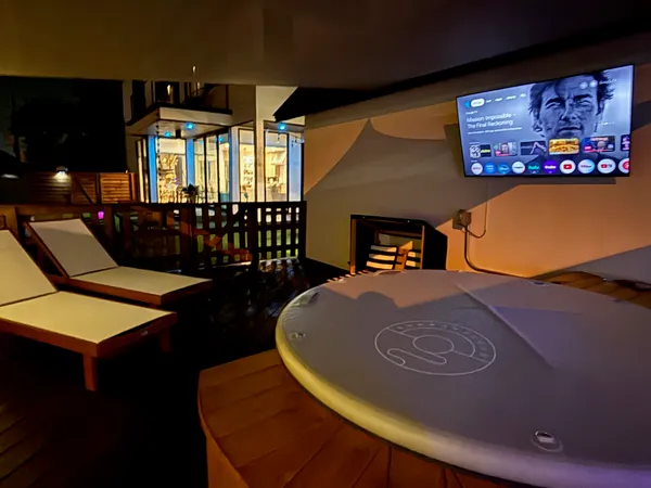 a view of a porch with furniture and a yard