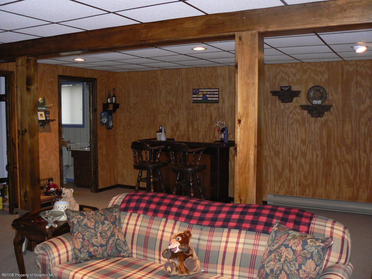 3198 Northgate Road Lake Ariel, PA 18436 - Photo 14 of 17 a bedroom with a bed and a table
