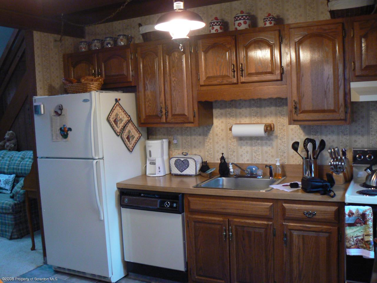 3198 Northgate Road Lake Ariel, PA 18436 - Photo 2 of 17 a kitchen with cabinets and a refrigerator