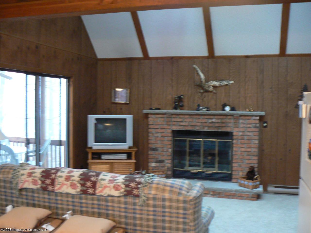 3198 Northgate Road Lake Ariel, PA 18436 - Photo 5 of 17 a living room with furniture windows and a fireplace