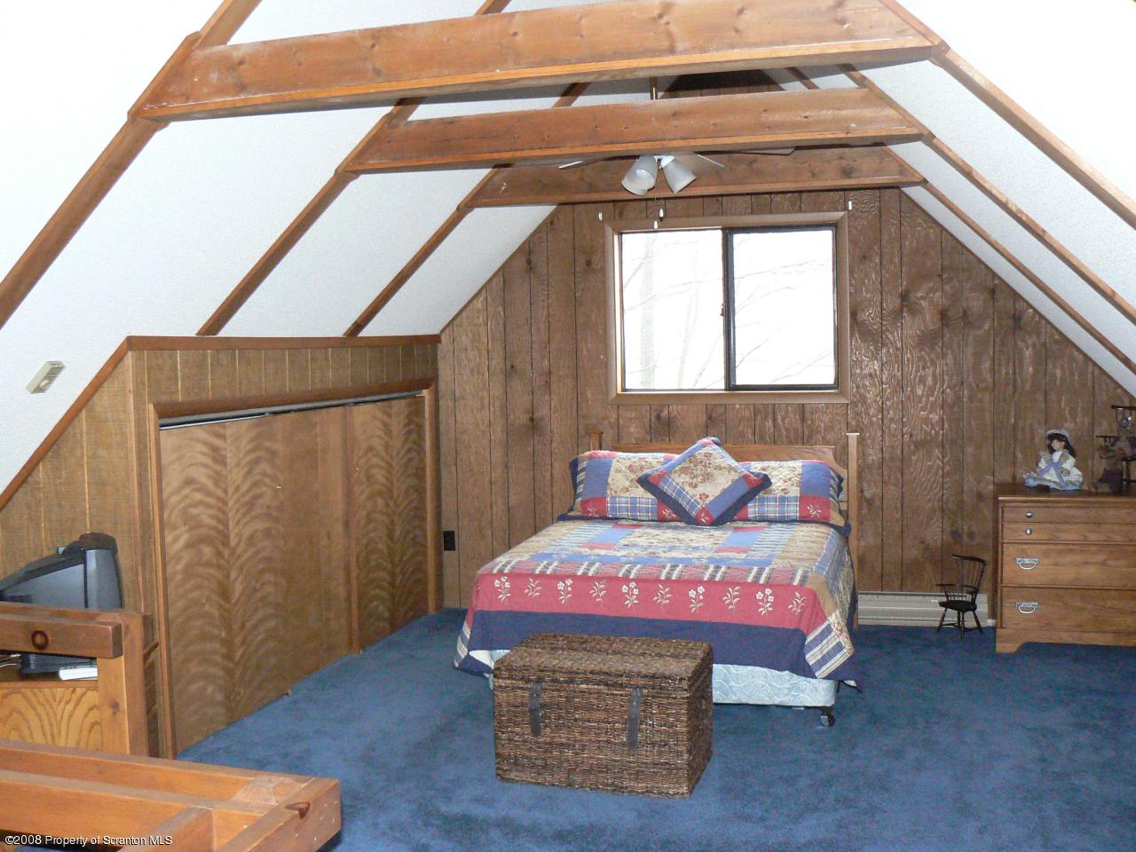 3198 Northgate Road Lake Ariel, PA 18436 - Photo 7 of 17 a bedroom with a bed and a mirror