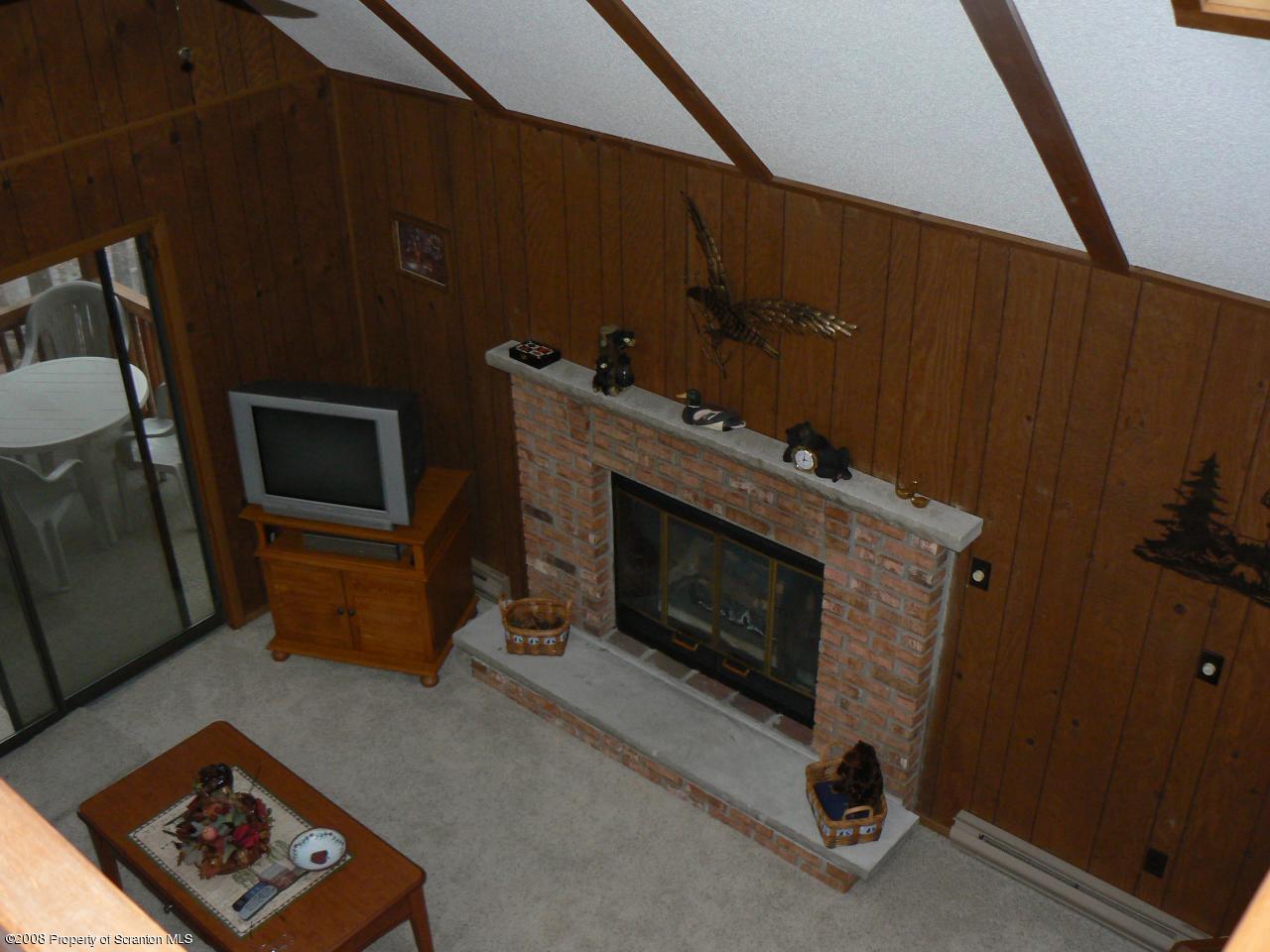 3198 Northgate Road Lake Ariel, PA 18436 - Photo 8 of 17 a living room with furniture and a fireplace