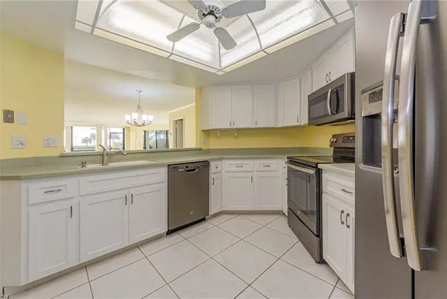 a kitchen with a refrigerator a sink and dishwasher