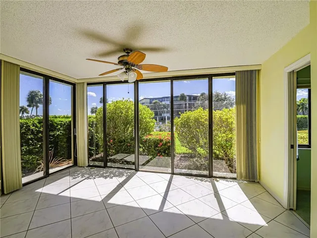 a view of empty room with ceiling fan