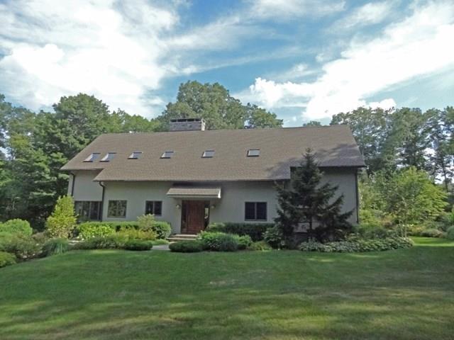 44 Chalburn Road Redding, CT 06896 - Photo 1 of 1 a view of a house with a garden
