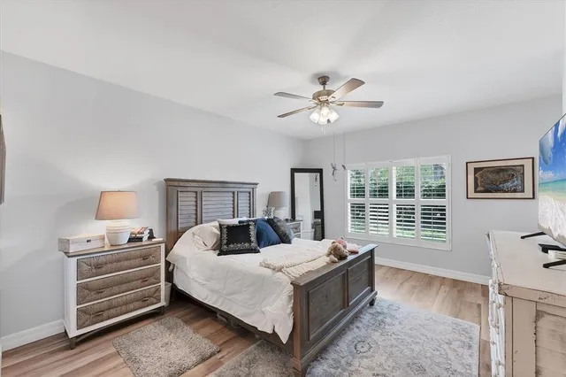 a bedroom with a large bed and a window