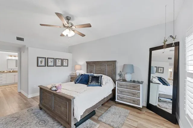 a bedroom with a bed and a couch