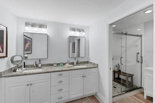 a bathroom with a toilet sink and a shower