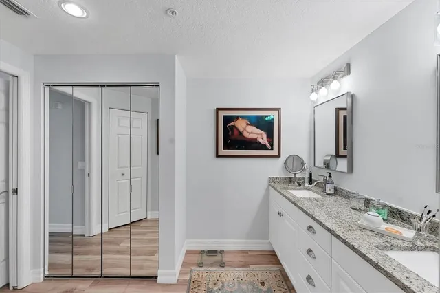a bathroom with a shower toilet and sink
