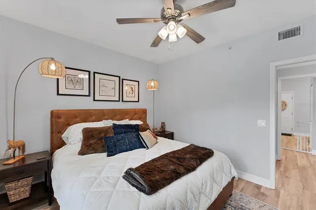 a view of a patio with couches chairs and backyard