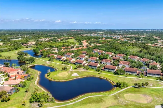 a view of a house with a small yard and plants