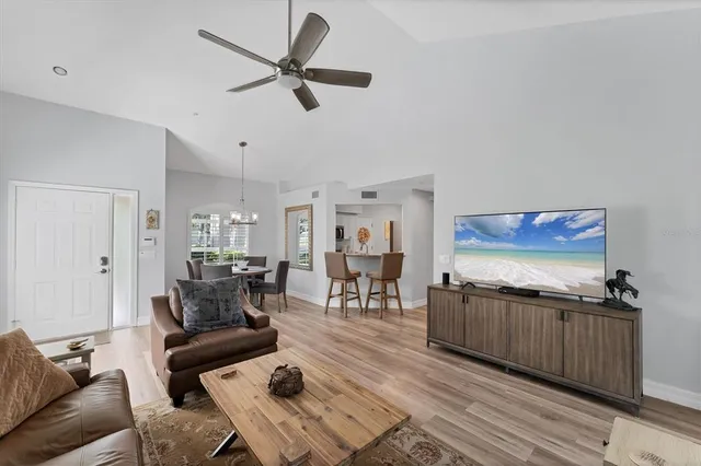 a kitchen with white cabinets sink and stainless steel appliances