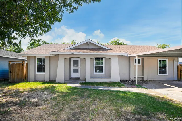 front view of a house with a yard