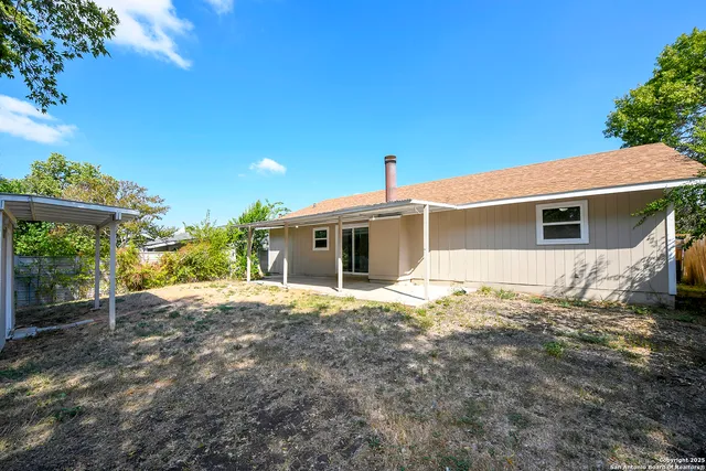 a house with trees in the background