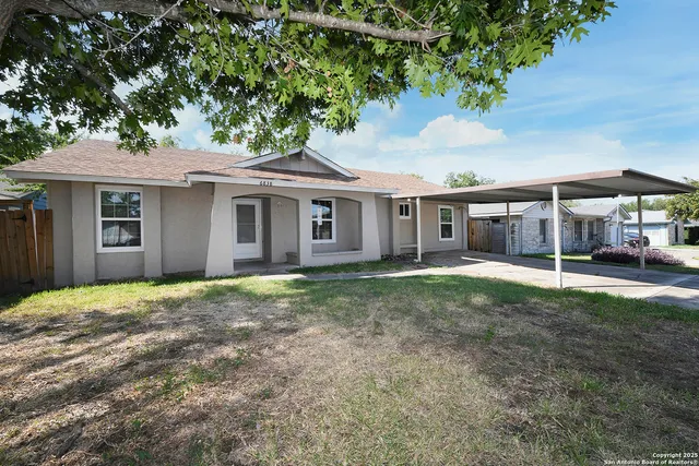 a house with trees in the background