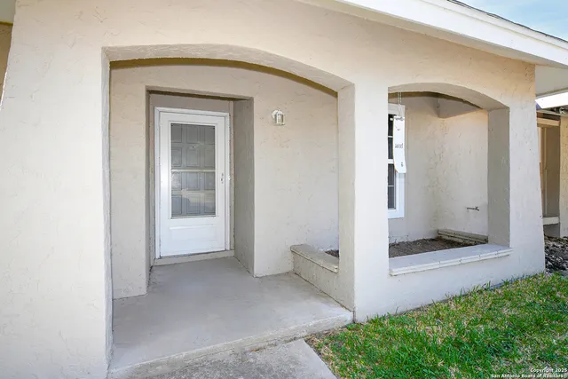 a view of an empty room with a bathroom