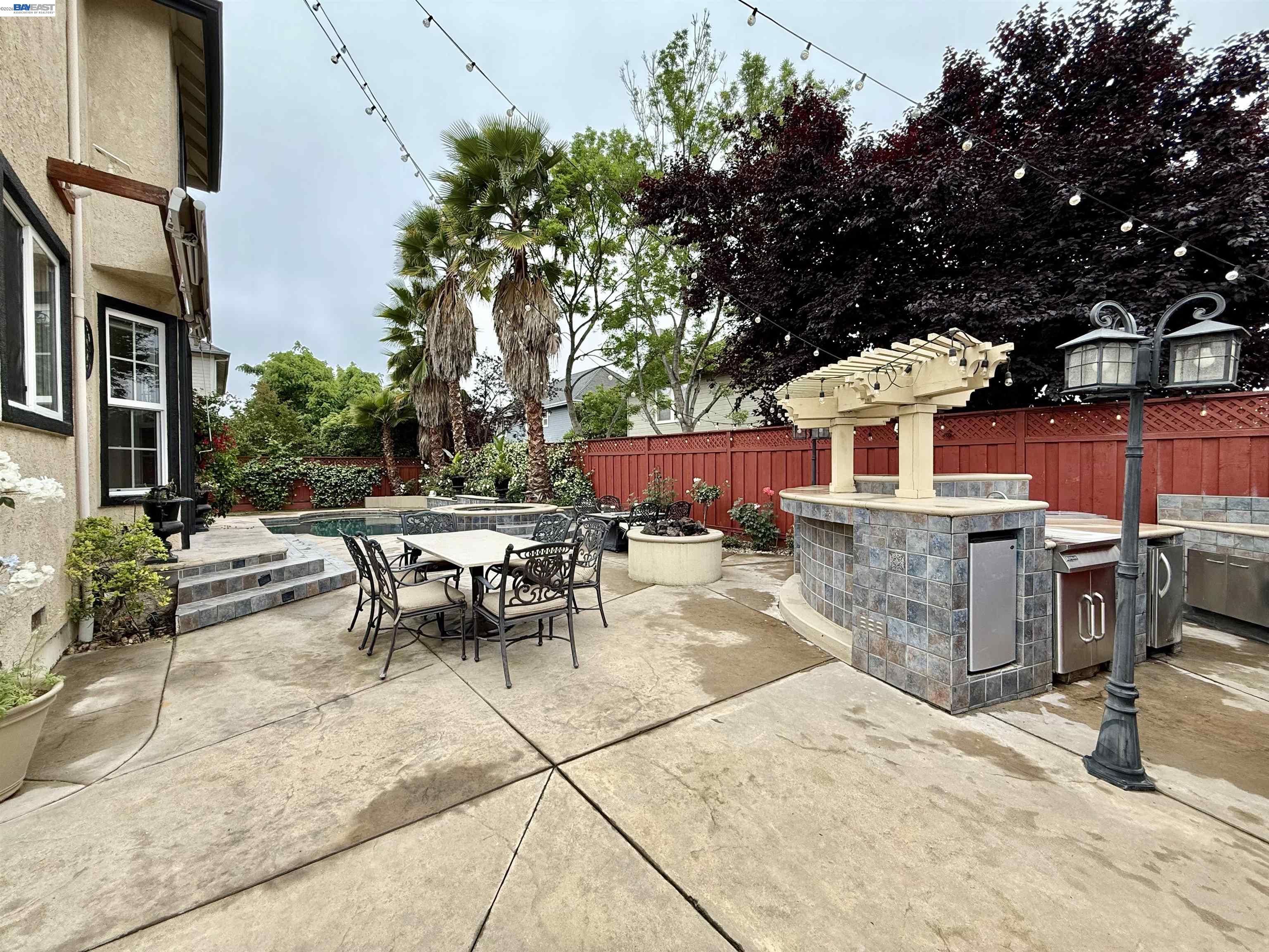 1284 Riesling Circle Livermore, CA 94550 - Photo 67 of 79 a view of a patio with a table and chairs and potted plants