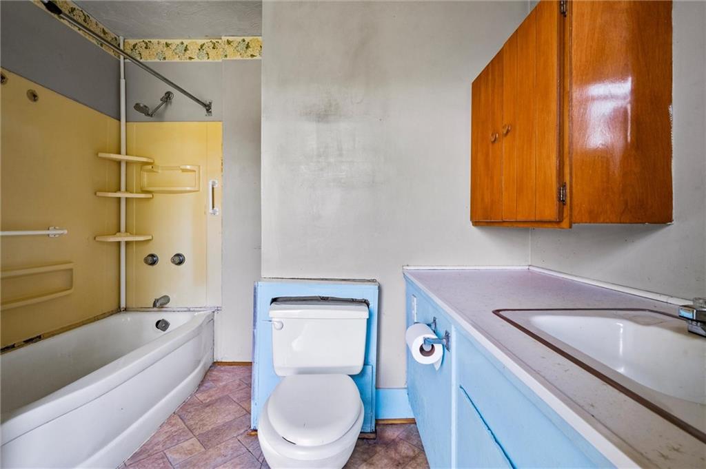 2789 Rutledge Road Transfer, PA 16154 - Photo 13 of 50 a bathroom with a toilet sink and mirror