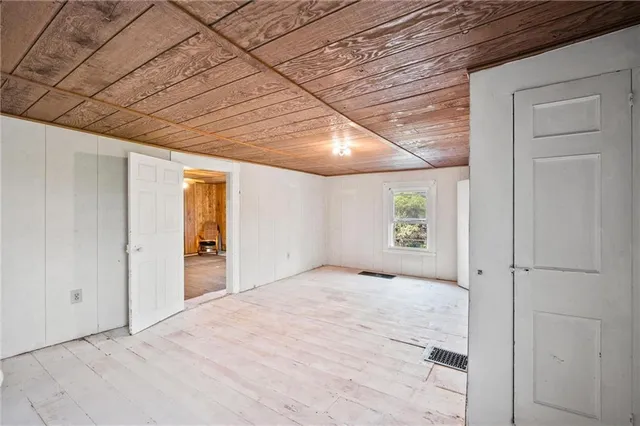 a big room with closet and windows