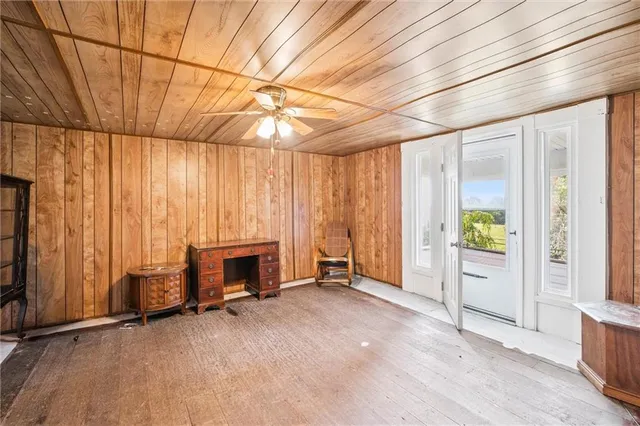 an empty room with furniture and a fireplace