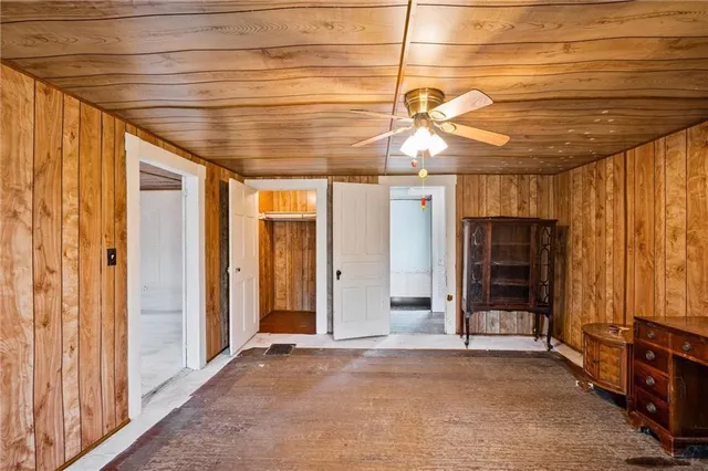 a view of a room with closet and chandelier