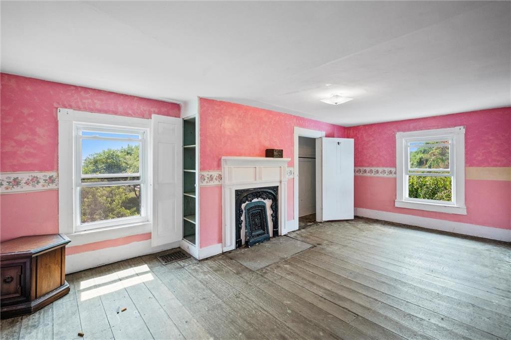 2789 Rutledge Road Transfer, PA 16154 - Photo 19 of 50 a view of a livingroom with a fireplace wooden floor and windows
