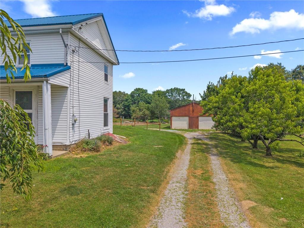 2789 Rutledge Road Transfer, PA 16154 - Photo 39 of 50 a backyard of a house with lots of green space