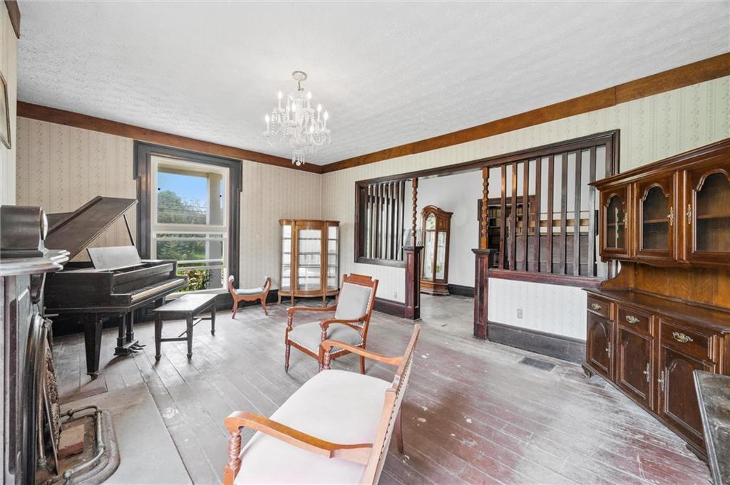 2789 Rutledge Road Transfer, PA 16154 - Photo 4 of 50 a living room with furniture a piano and a chandelier
