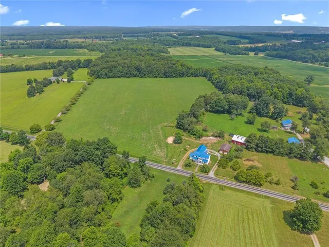 a view of a town with mountains in the background