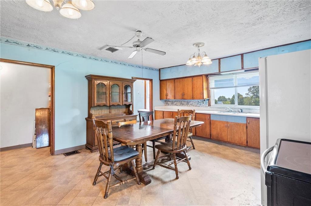 2789 Rutledge Road Transfer, PA 16154 - Photo 8 of 50 a view of a dining room with furniture and chandelier