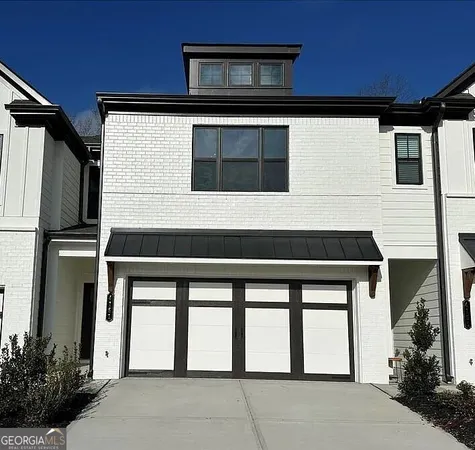 a front view of a house with a garage