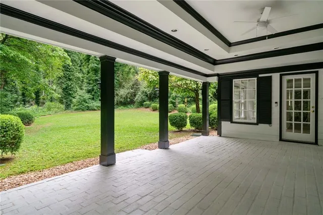 a view of a porch with a big yard