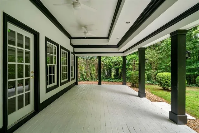 a view of an empty room with windows
