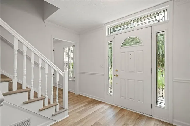 a view of entryway with wooden floor
