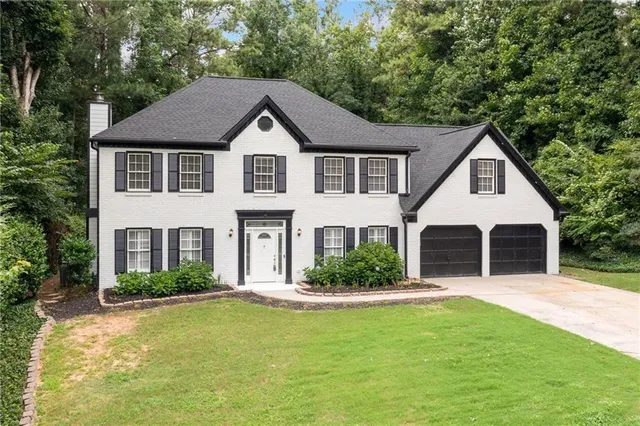 a front view of a house with a yard