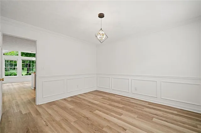 a view of a room with wooden floor