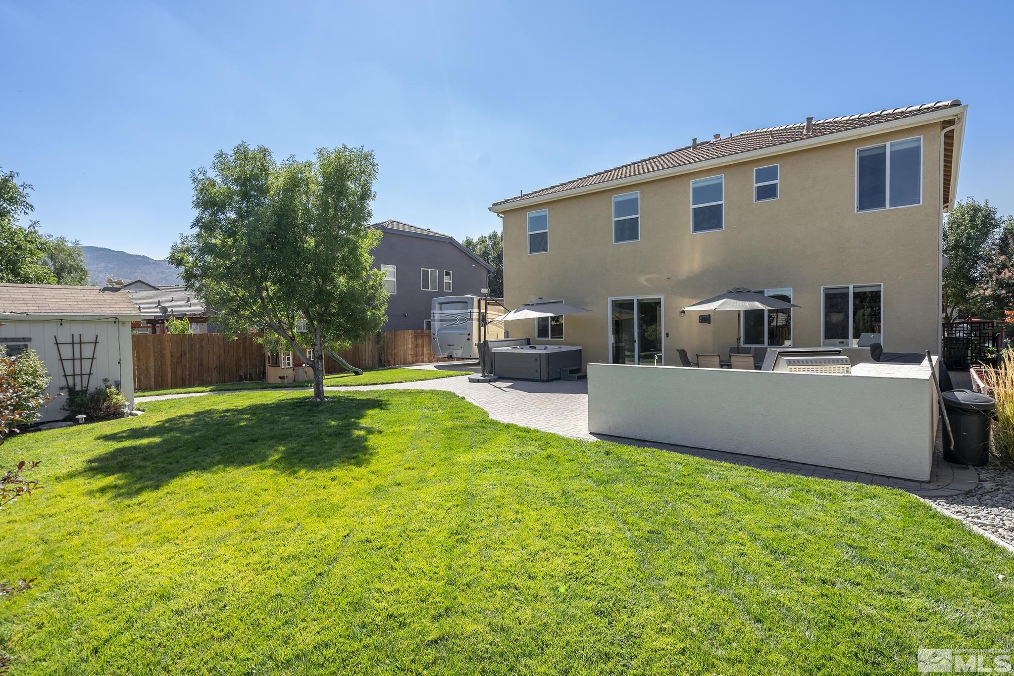375 Sondrio Way Reno, NV 89521 - Photo 1 of 36 a front view of house with yard and trees