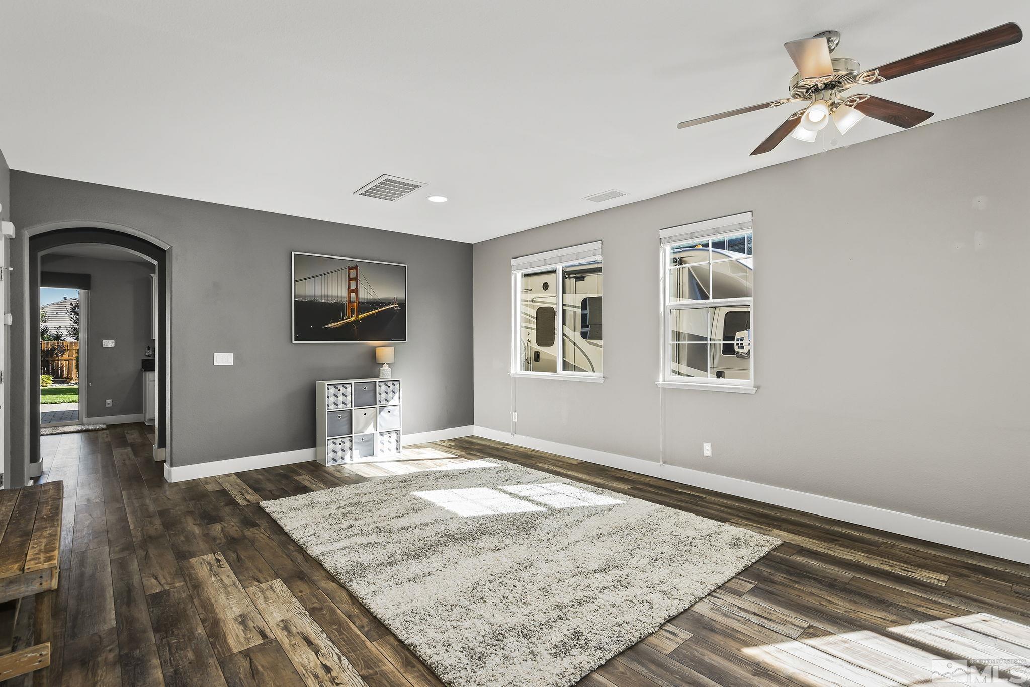 375 Sondrio Way Reno, NV 89521 - Photo 16 of 36 a bedroom with a bed and a flat screen tv