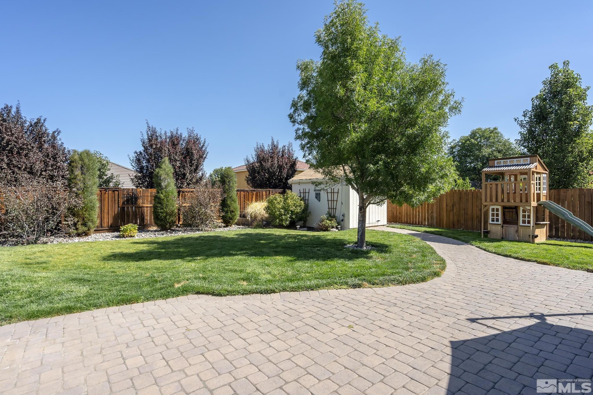 375 Sondrio Way Reno, NV 89521 - Photo 30 of 36 a view of a backyard with a garden