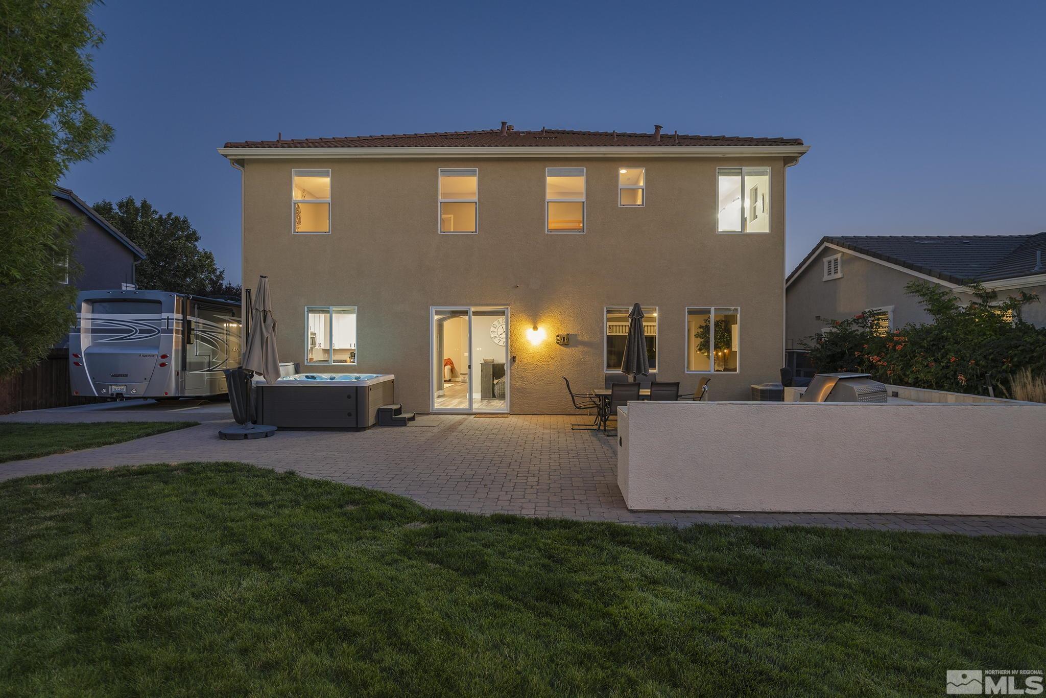375 Sondrio Way Reno, NV 89521 - Photo 33 of 36 a front view of a house with a yard and outdoor seating