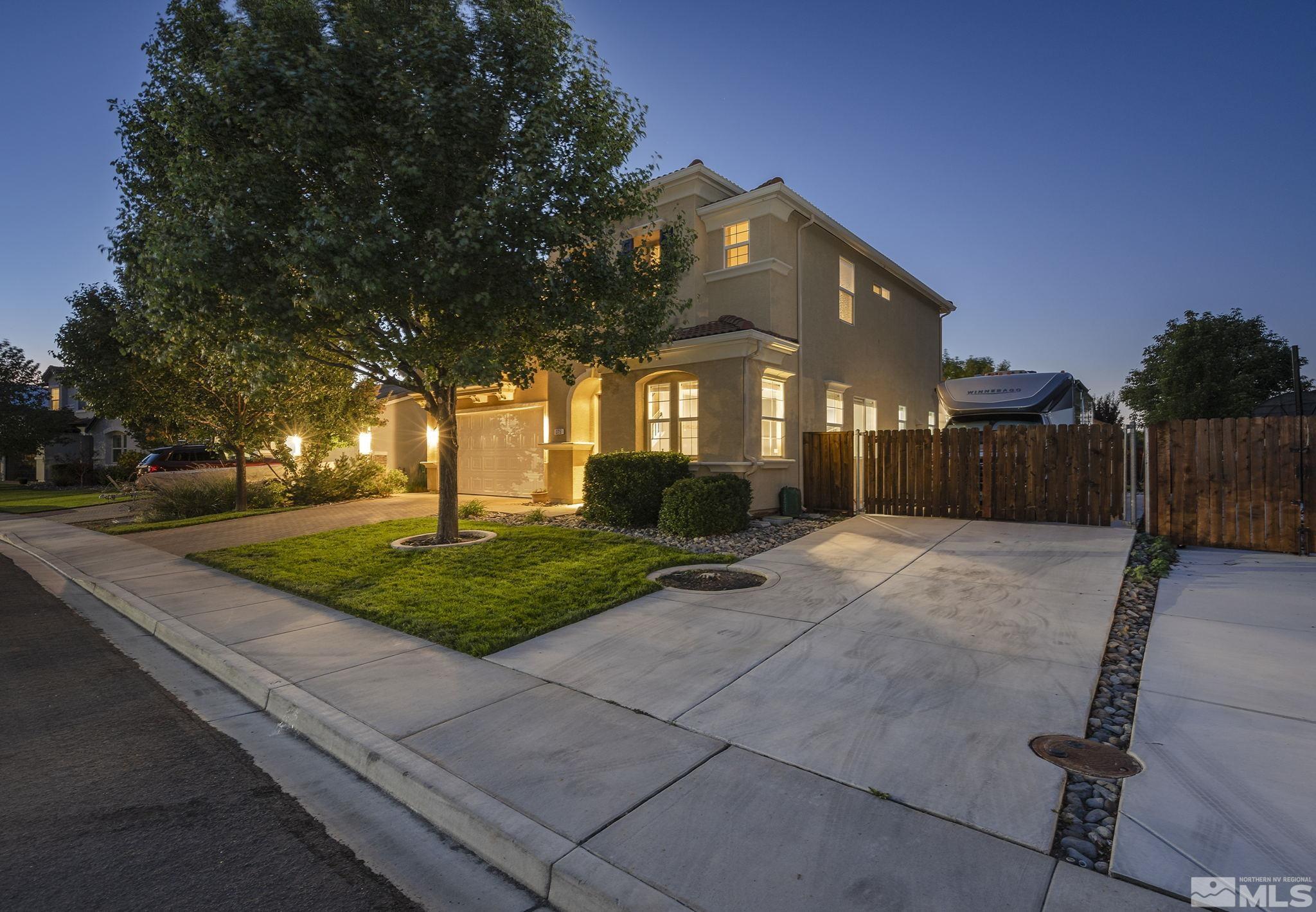 375 Sondrio Way Reno, NV 89521 - Photo 4 of 36 a view of a house with backyard and a tree