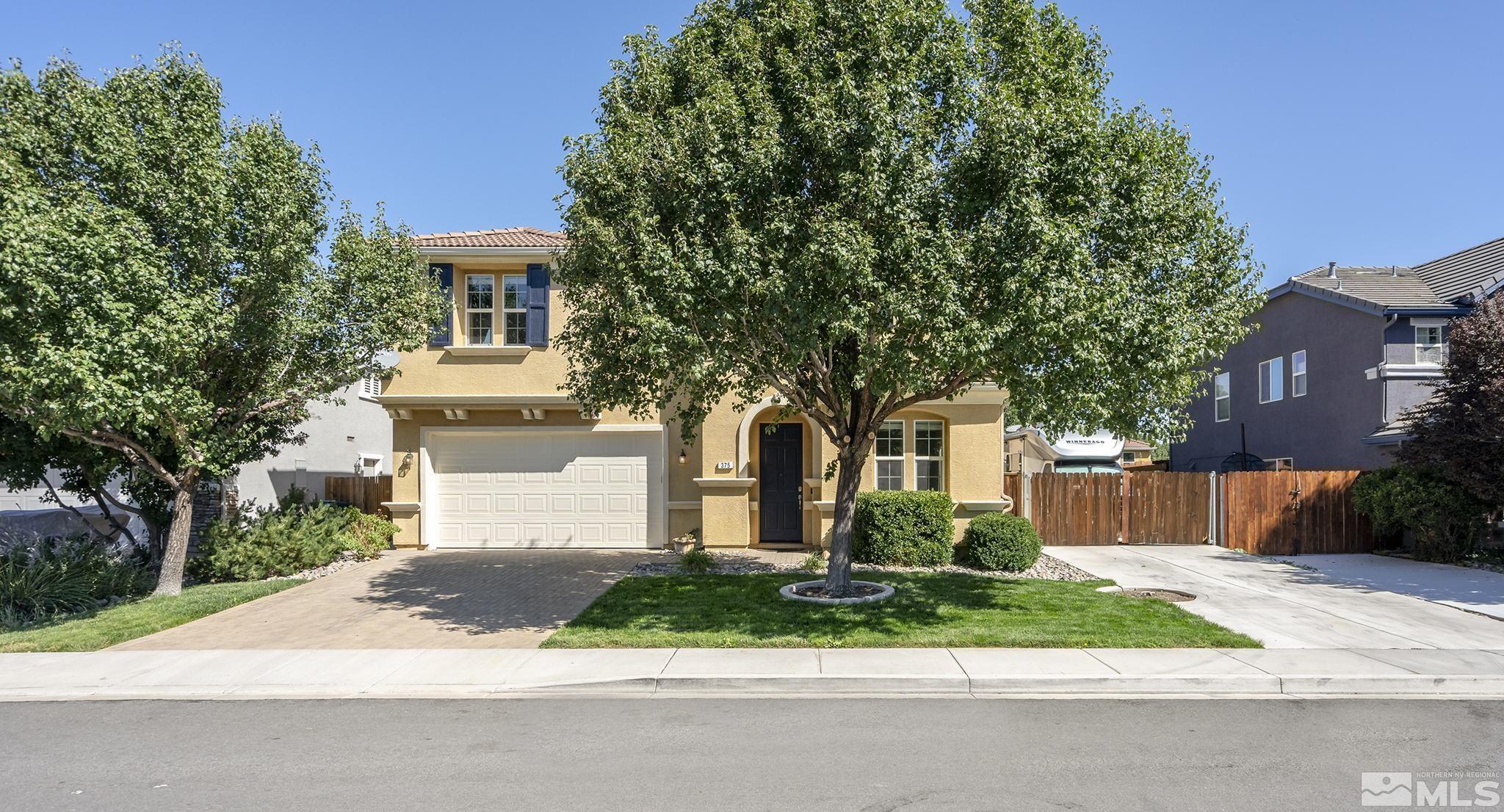 375 Sondrio Way Reno, NV 89521 - Photo 7 of 36 a front view of a house with a garden