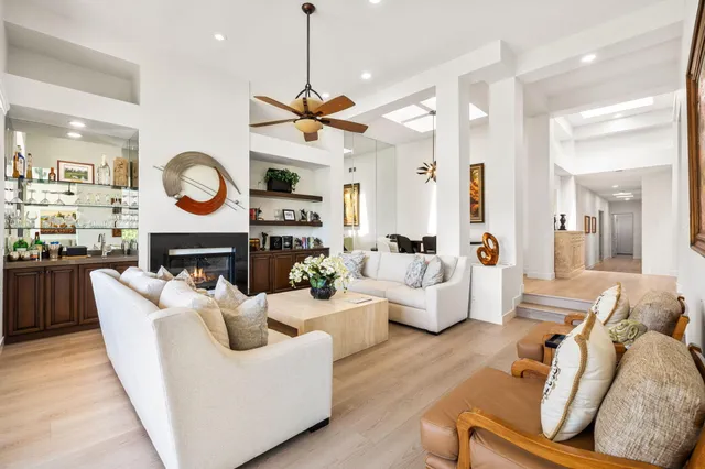 a kitchen with stainless steel appliances a stove and a wooden floor