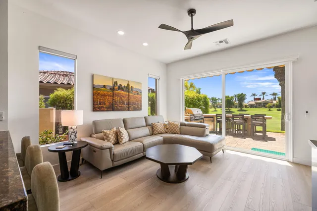 a kitchen with stainless steel appliances granite countertop a stove a microwave and cabinets