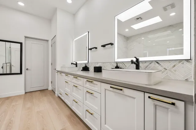 a spacious bedroom with a large bed and a large window