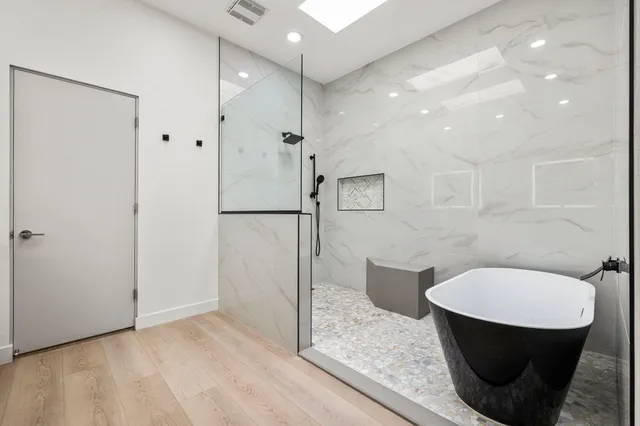 a bathroom with a sink a vanity and a mirror