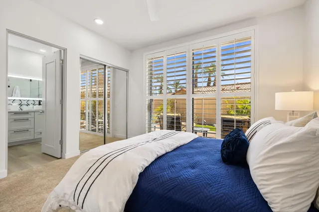 a kitchen with cabinets and window