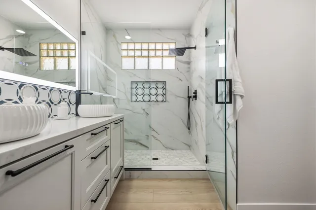 a bathroom with a sink and a mirror