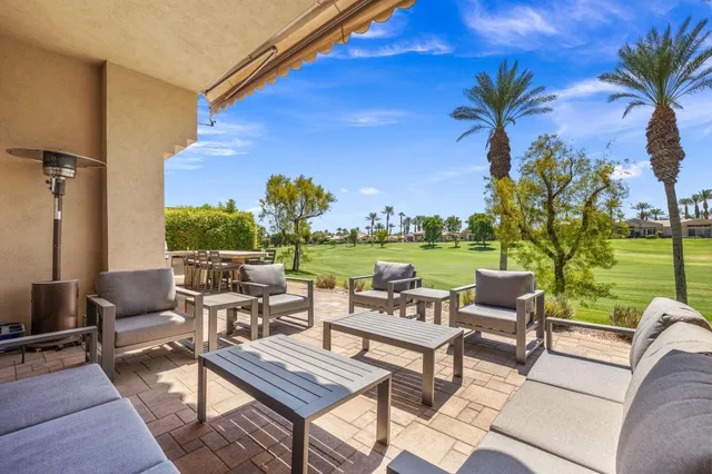 a view of two chairs in the balcony