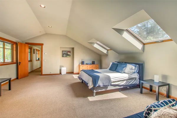 a bedroom with a bed and a couch